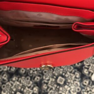 New red Kate spade back pack purse